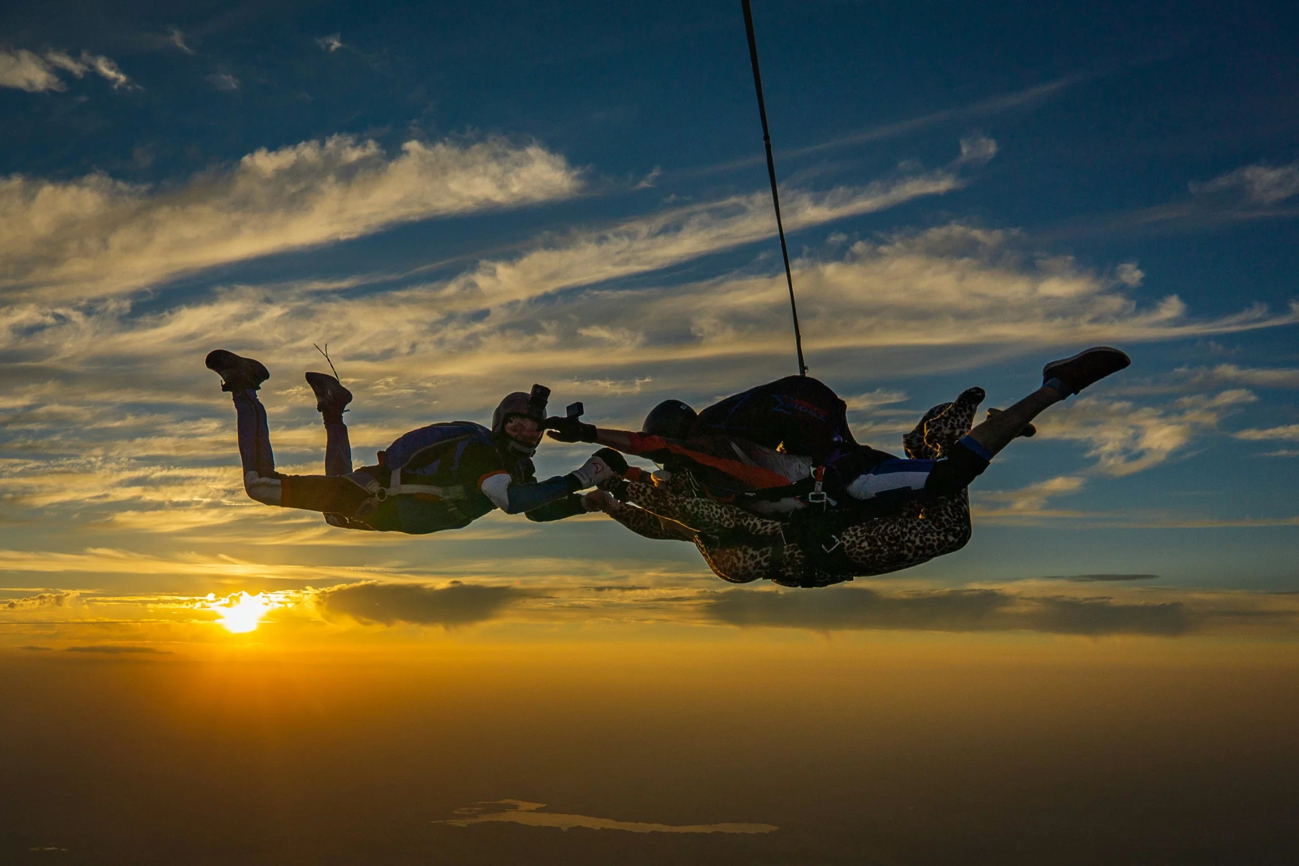 Injured skydivers look for help with SoftWave Therapy.