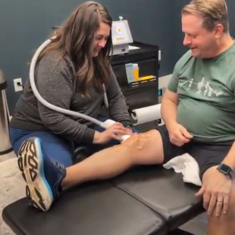 A man gets SoftWave Therapy treatments after knee replacement surgery.